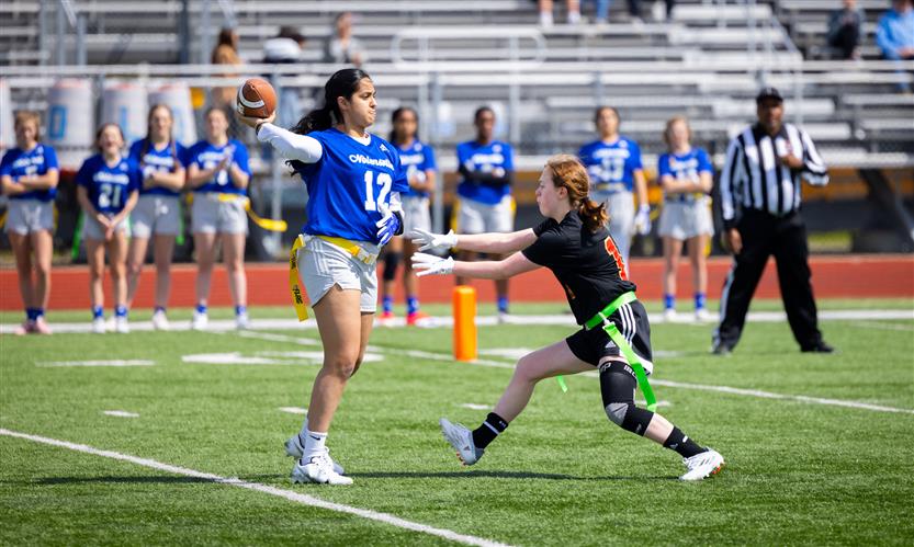 Girls play flag football